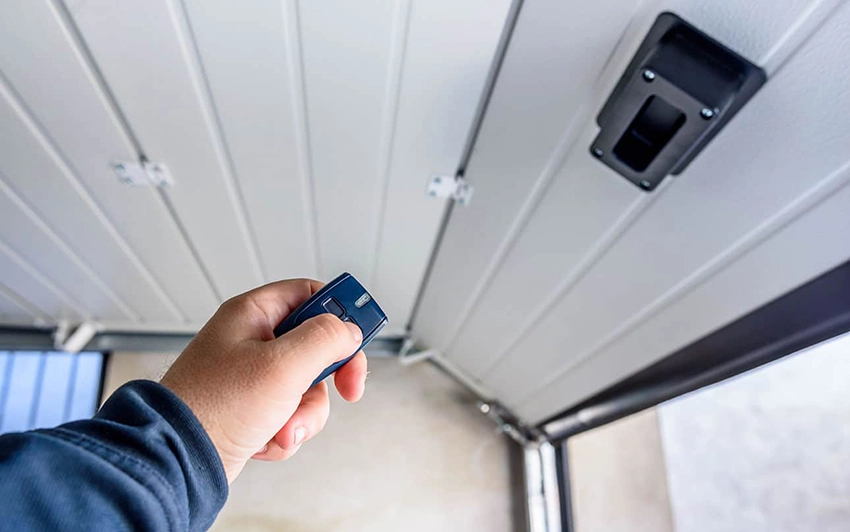 This image has an empty alt attribute; its file name is Choosing-the-Right-Battery-for-Your-Garage-Door-Opener-Remote.webp